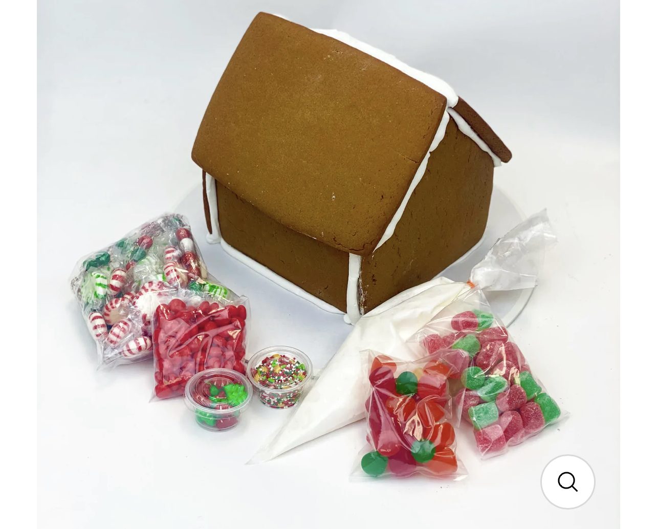 A gingerbread house kit with bagged candies and icing