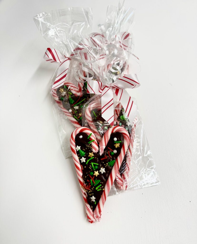 Peppermint candy favors wrapped in cellophane with a ribbon