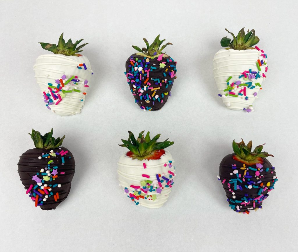 Chocolate-dipped strawberries finished with colored sprinkles